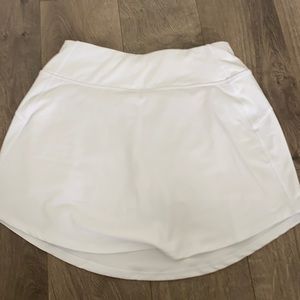 White DSG athletic exercise tennis skirt with built in shorts